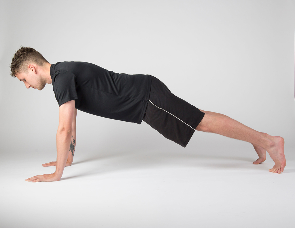 student in plank
